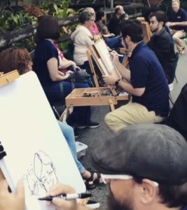 Goofy Faces caricature artists drawing at the Tampa Zoo