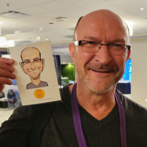 Event guest with their caricature print
