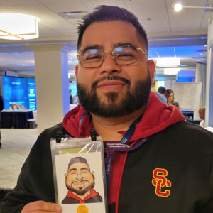 Event guest with their caricature print
