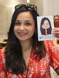 Event guest with their caricature print