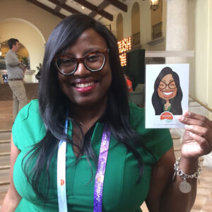 Event guest with their caricature print